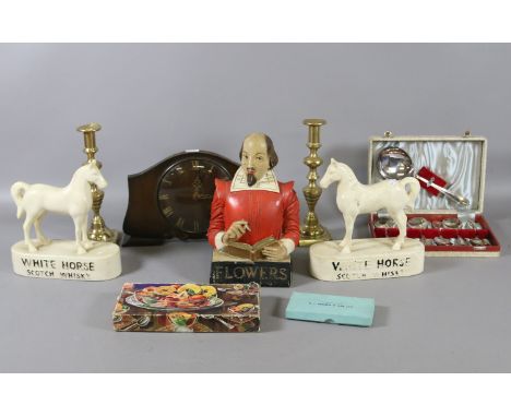 Two White Horse Scotch Whiskey advertising figures, a pair of brass candlesticks, an electric mantel clock, boxed plated cutl