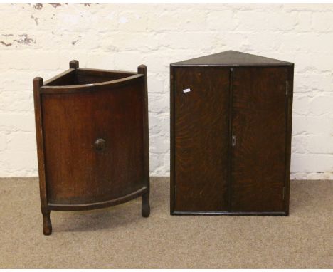 An oak carved stick stand along with an oak corner cupboard.