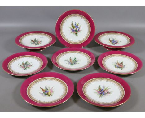 A Royal Worcester part dessert service. Enamelled with flower sprays under red banded borders.