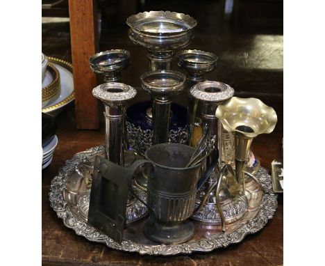A collection of silver plate and metalware including arts and crafts photograph frame, three flute epergne, pierced sugar bas