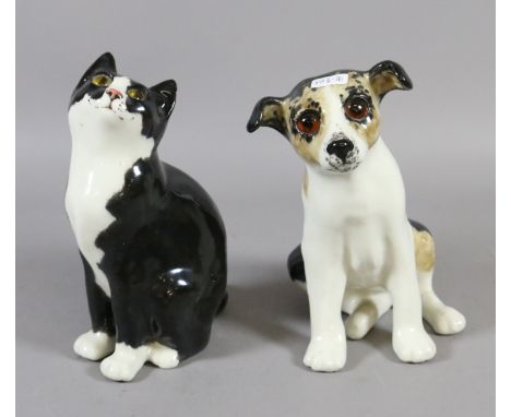 A Winstanley ceramic model of a puppy and kitten with glass eyes.