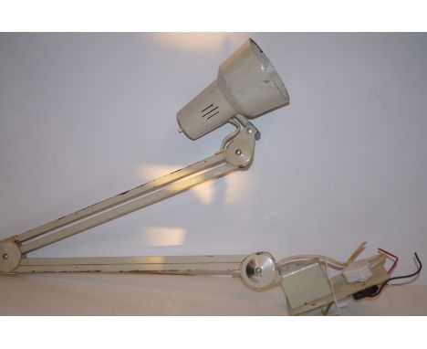 Wall mounted, angle poise lamp.