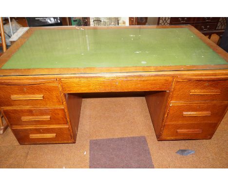 Light solid oak, twin pedestal desk with leather inlay and glass protector
