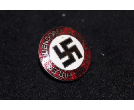 Enamel pin badge depicting a swastika