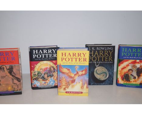 Collection of five, first edition Harry Potter books.