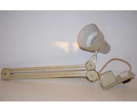 Wall mounted, angle poise lamp.