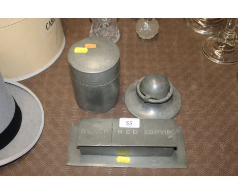 A pewter inkwell; a three section pewter inkwell; and a pewter caddy decorated with dragons and birds 