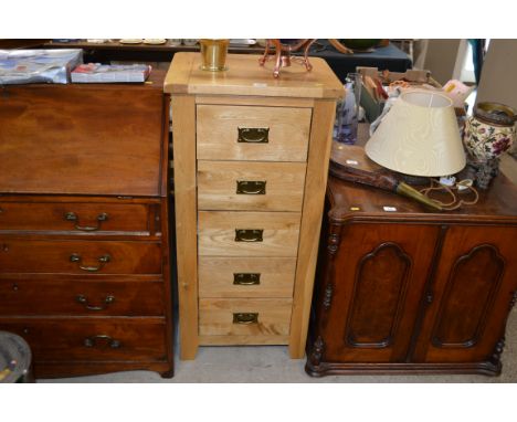 A light oak chest fitted five drawers 