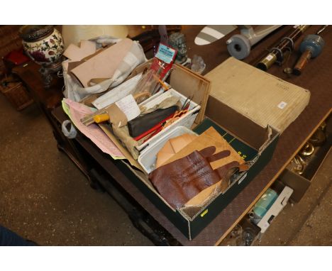 A quantity of leather tools and off-cuts of leather