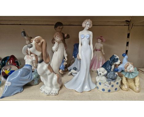 A group of 11 Nao porcelain figures. 