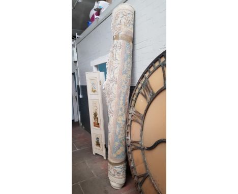 A large Chinese wool carpet, cream ground decorated with flowers.Width 250cm approx 