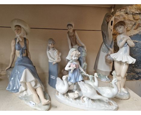 A group of six Lladro, Nao and similar figures. 