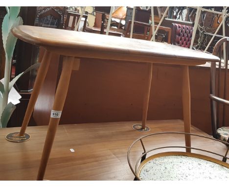 A mid 20th century Ercol light elm coffee table. Length 72.5cm There are some surface marks and slight splitting to the top.