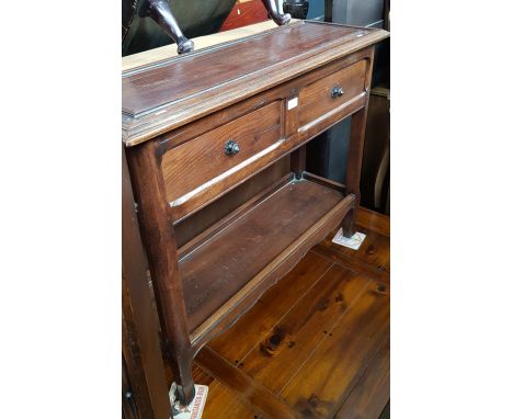 A French aged oak console table with two drawers. 