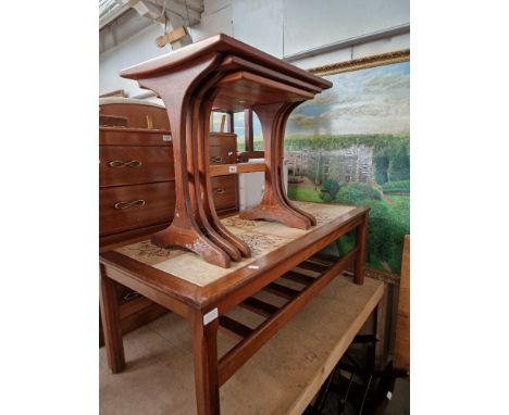 A mid 20th century G Plan teak nest of tables together with a teak and tile top coffee table. 