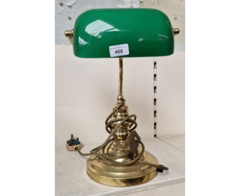 A green glass and brass angle desk lamp 