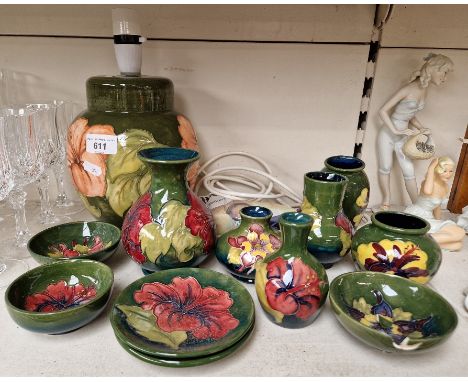 Large Moorcroft lamp base, six small Moorcroft vases and some small dishes.&nbsp;Bulbous vase height 13.5cm, dishes diameter 