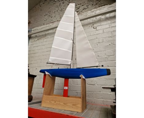 A model pond yacht on stand. 