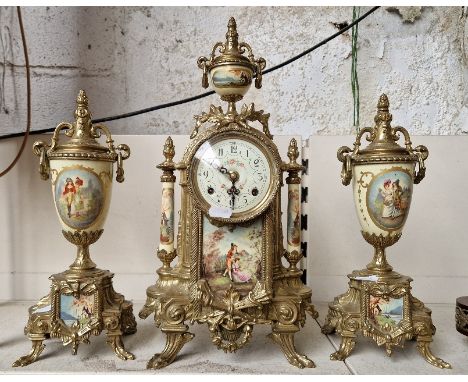 A German mantle clock and garnitures.Condition:- General wear through age and use, bottom plaques on each garneture has been 
