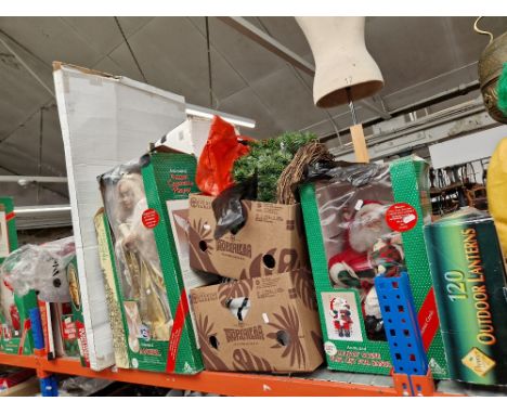 A collection of Christmas decorations including animated and light up models. 