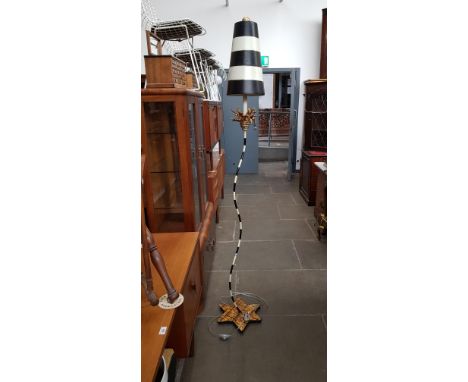 A painted metal standard lamp 