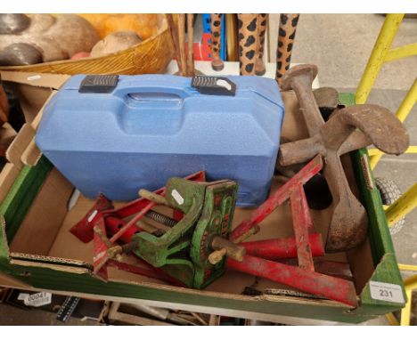 Assorted tools comprising a pair of axel stands, a bench vice, two lasts and a belt sander. 