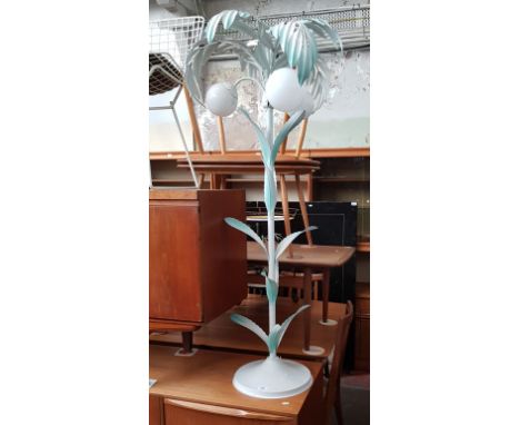 A metal floor standing lamp modelled as a palm tree. 