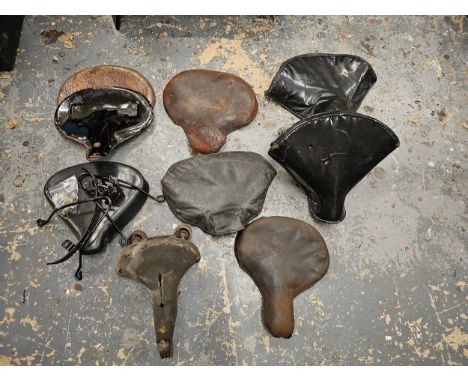 A Dunlop vintage seat and other various vintage motorcycle seats. 