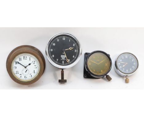 A group of four 20th century dashboard clocks comprising Smiths of London, the black dial with white Arabic numerals and the 
