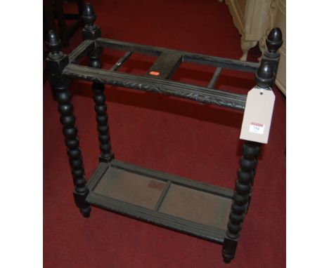 A circa 1900 ebonised oak bobbin turned four tier stick stand