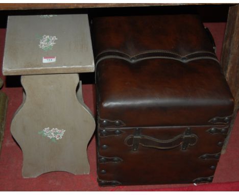 A brown leather upholstered hinge top travelling trunk, together with a magazine rack (2)