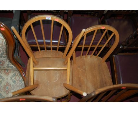 A set of three Ercol light elm stickback kitchen chairs