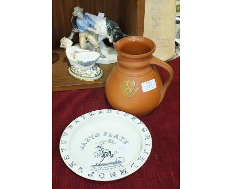 A Wedgwood terracotta ale jug decorated with the Corpus Christi College crest, with impressed registration mark for 1850 and 