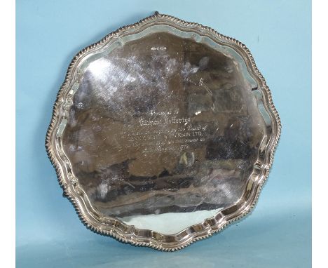 A Chippendale-style salver with gadrooned border, on four claw and ball feet, 37cm diameter, Sheffield 1971, by Alexander Cla
