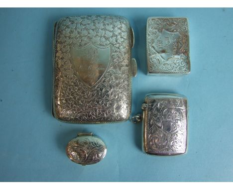 A cigarette case with overall leaf decoration, inscribed within shield, 8 x 6cm, Chester 1899, a Vesta case, Birmingham 1909,