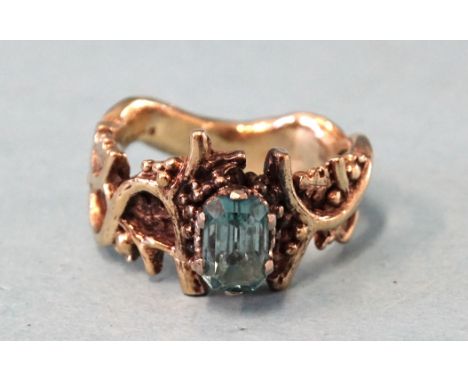 A 9ct gold ring of naturalistic form set blue stone, size M, 5.7g. 