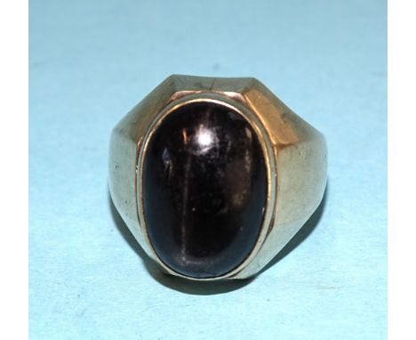 A 14ct gold ring set a large chatoyant black stone, size S, 11.7g. 