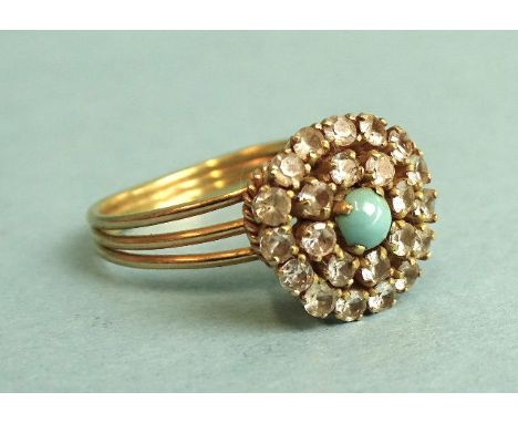 A turquoise and white stone cluster ring, in yellow gold mount bearing Middle Eastern gold marks for '18ct', size N, 4.7g. 