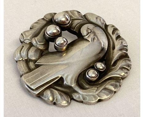 A vintage Georg Jensen silver bird brooch #165 with "silver pearl" detail. Designed by K. Mohl Hansen, fully hallmarked to re