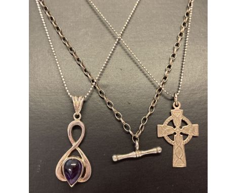 3 silver necklaces, all marked 925 or silver. A modern design pendant set with amethyst on an18 inch bead chain, a Celtic cro