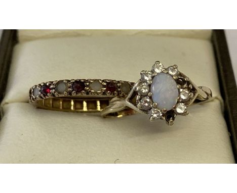 2 9ct gold dress rings for repair or scrap. A full eternity ring set with garnets and clear stones and an oval cut opal surro