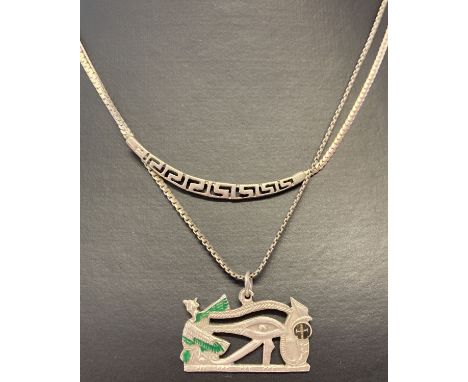 2 silver necklaces. A silver fixed pendant necklace with Greek key decoration. Together with an Egyptian style pendant with e