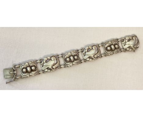 A vintage Georg Jensen silver 6 link bracelet with dove &amp; foliage motifs and "silver pearl" detail. Designed by K. Mohl H