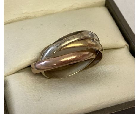 A 9ct gold tri colour gold Russian wedding ring. 3 interlinked bands, one each of rose, yellow and white gold. Ring size K. T