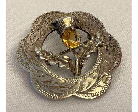 A vintage Scottish silver brooch with citrine set thistle design. Hallmarked for Ward Brothers, Glasgow, 1953. Approx. 2.8cm 