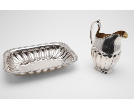 with lobed decoration and ribbed borders, the ewer with a scroll handle, initialled and gilt interior, possibly by Alexander 