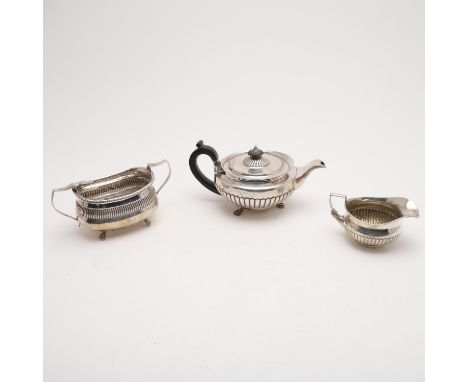 with part-fluted decoration, claw feet &amp; a "cape" rim, together with a matching milk jug, both pieces faintly inscribed o