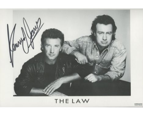 Kenney Jones signed 6x8 black and white The Law photo. Jones is an English drummer best known for his work in the groups Smal