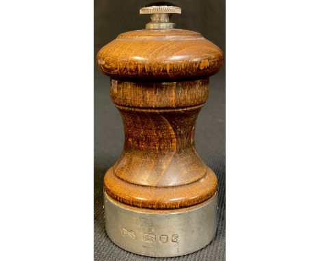 An Elizabeth II silver mounted turned oak pepper grinder, London 1976 