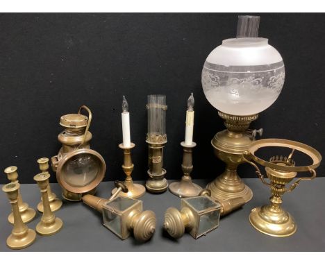 A GWR (Great Western Railway) brass carriage lamp; a brass Powell &amp; Hanmer Ltd. coaching lamp, N0.540; a brass oil lamp; 